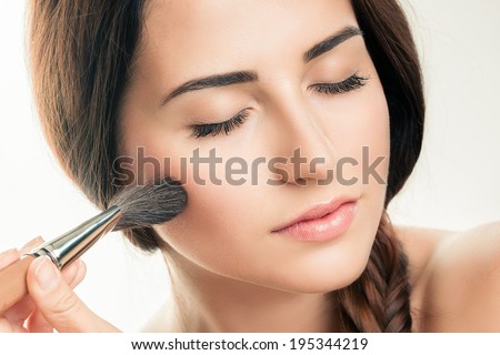 Makeup Applying  closeup. Cosmetic Powder Brush. Perfect Skin