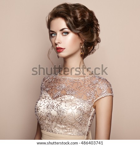 https://thumb7.shutterstock.com/display_pic_with_logo/493354/486403741/stock-photo-fashion-portrait-of-beautiful-woman-in-elegant-dress-girl-with-elegant-hairstyle-and-jewelry-486403741.jpg