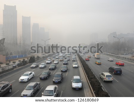 BEIJING - MAY 9: Traffic jam and smog in Beijing's Central Business District on May 9, 2012 in Beijing, China.Beijing is expected to pass the six million vehicles on its roads by the end of the year.