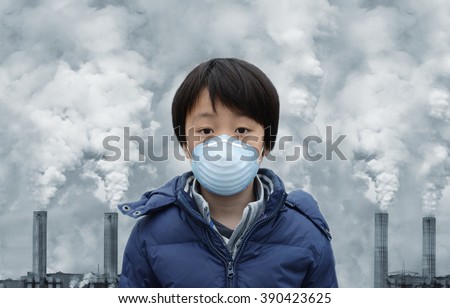 Asian boy wearing mouth mask against air pollution