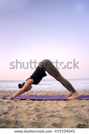 https://thumb7.shutterstock.com/display_pic_with_logo/502753/419104645/stock-photo-outdoor-on-beach-girl-yoga-trainer-at-home-yoga-ahead-of-the-ocean-around-exotic-india-419104645.jpg
