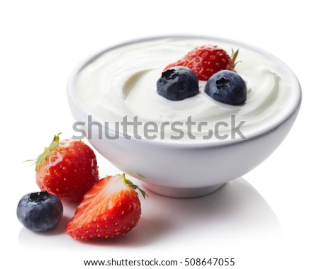 Bowl of greek yogurt and fresh berries isolated on white background