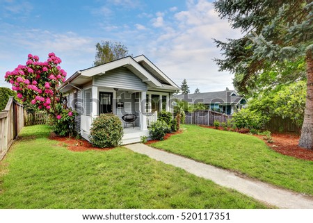 cute craftsman home exterior with green grass and blooming tree northwest usa - Craftsman Home Exterior cute craftsman home exterior with green grass and blooming tree northwest usa - Craftsman Home Exterior