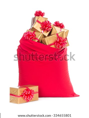 Red big Santa Christmas sack full of and surrounded by golden wrapped gift boxes with bows isolated on a white background