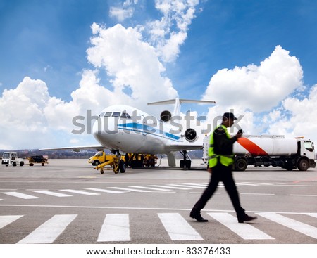 Aircraft maintenance people during refueling