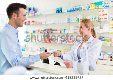 Pharmacist and client at pharmacy
