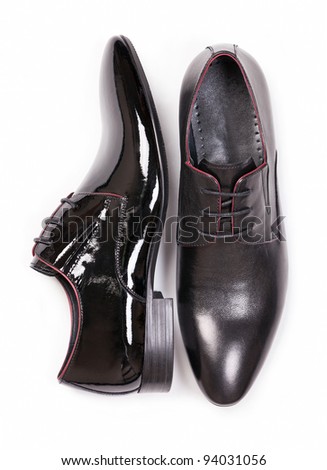 Two black men shoes against white background, view from above - stock photo