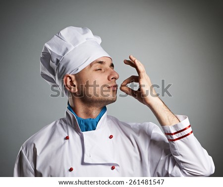 stock-photo-male-chef-kissing-fingers-against-grey-background-261481547.jpg