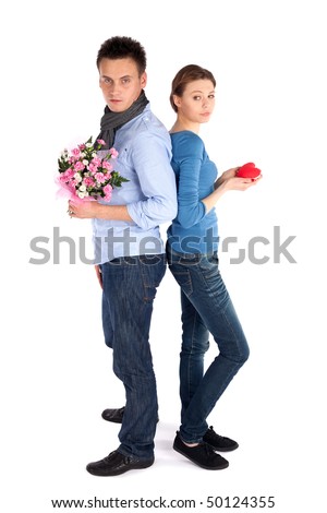 https://thumb7.shutterstock.com/display_pic_with_logo/52846/52846,1270229861,1/stock-photo-full-body-young-attractive-couple-standing-back-to-back-woman-holding-heart-man-holding-flowers-50124355.jpg