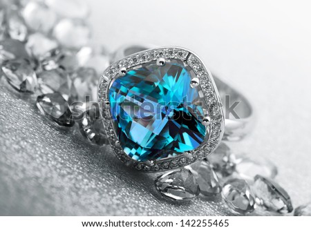 Various Jewelry gem stones on grey background