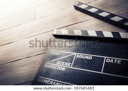 vintage photo of movie clapper on wood