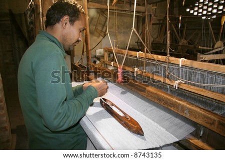 weaver working handloom at workshop, delhi, india