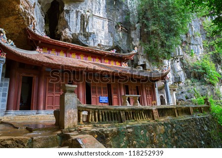 Wide angle view of old vietnamese temple over rocks