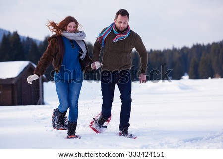 https://thumb7.shutterstock.com/display_pic_with_logo/54809/333424151/stock-photo-happy-young-couple-having-fun-and-walking-in-snow-shoes-romantic-winter-relaxation-scene-333424151.jpg
