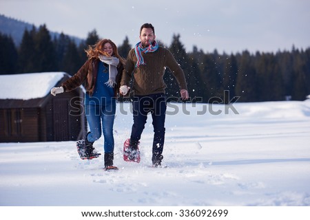 https://thumb7.shutterstock.com/display_pic_with_logo/54809/336092699/stock-photo-happy-young-couple-having-fun-and-walking-in-snow-shoes-romantic-winter-relaxation-scene-336092699.jpg