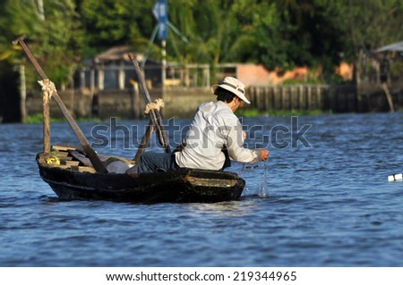 CAI RANG - FEB 17: Unidentified Vietnamese fisherman fishing in the Mekong delta. After the Ganges delta, Mekong delta is the second biggest delta in the world. On Feb 17, 2013 in Cai Rang, Vietnam