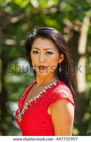 stock photo sexy mature asian woman with red dress 447735907
