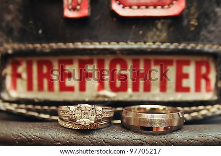 Wedding Rings On Firefighters Hat Stock Photo 97705217 Shutterstock   Stock Photo Wedding Rings On A Firefighters Hat 97705217 