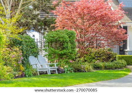 Adirondack Chairs Sitting On Grass Front Stock Photo ...