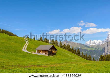 Swiss Mountain House beautiful swiss mountain valley landscape house stock photo Swiss Mountain House beautiful swiss mountain valley landscape house stock photo