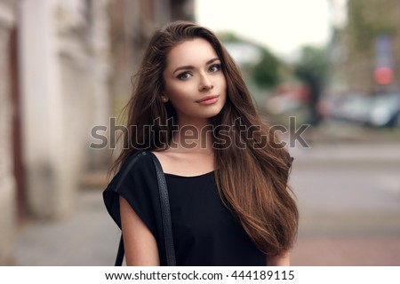https://thumb7.shutterstock.com/display_pic_with_logo/571009/444189115/stock-photo-fashion-style-portrait-of-young-beautiful-elegant-woman-in-black-dress-walking-at-city-streets-on-a-444189115.jpg