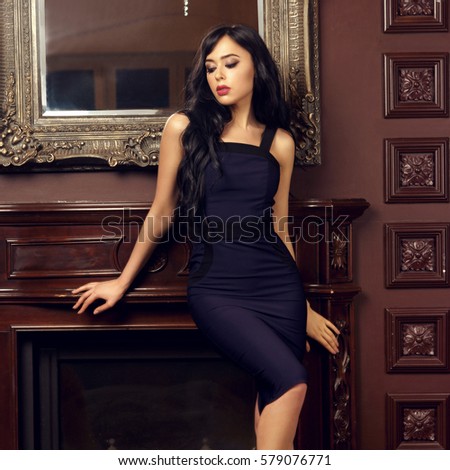 https://thumb7.shutterstock.com/display_pic_with_logo/571009/579076771/stock-photo-pretty-beautiful-sexy-woman-in-dark-blue-sheath-cocktail-dress-posing-in-luxury-interior-fashion-579076771.jpg