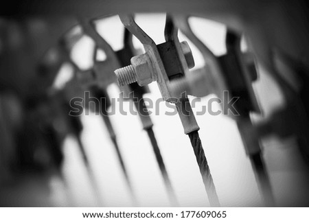 Static structural bridge abutment screw wire connector miniature metal model close up detail, black and white