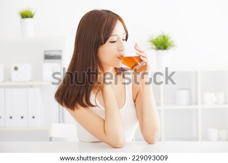beautiful Young asian woman drinking tea
