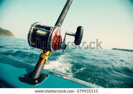 Fishing trolling tuna with a motor boat in the Andaman Sea coast of Thailand. Image retro vintage filter effect.