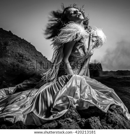 Black white fine art portrait of attractive romantic woman at fairy tale dry field Black white fine art portrait of attractive romantic woman at fairy tale dry field