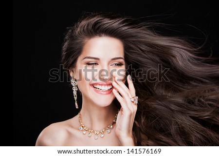portrait of a beautiful brunette girl with luxury accessories.Beauty with jewellery. happy fashion model
