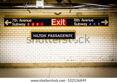 NYC Penn Station subway directional sign on tile wall