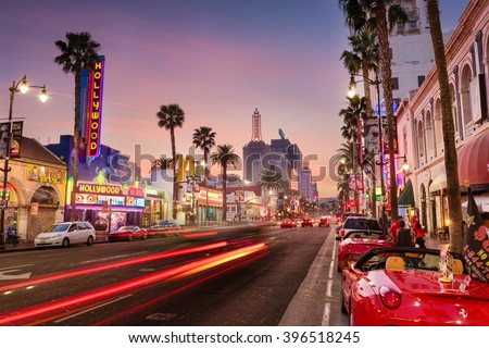 LOS ANGELES, CALIFORNIA - MARCH 1, 2016: Traffic on Hollywood Boulevard at dusk. The theater district is a famous tourist attraction.