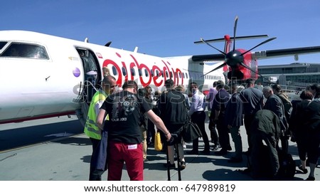 WARSAW, POLAND - MAY, 18, 2017. Air Berlin propeller plane boarding at the airport