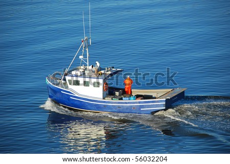 Bleu Fishing boat heading out to the ocean in the early morning