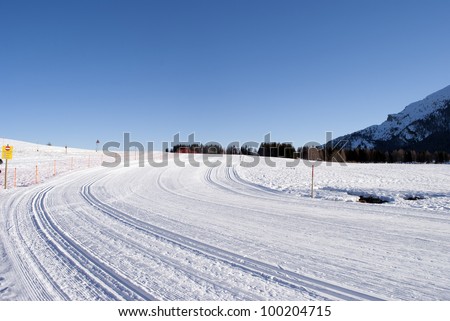 wintry landscape scenery with modified cross country skiing way. Bondone mountain in Trentino. Italy