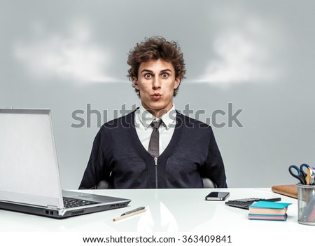 stock-photo-young-businessman-with-steam-from-his-ears-businessman-at-the-workplace-looking-at-camera-on-grey-363409841.jpg