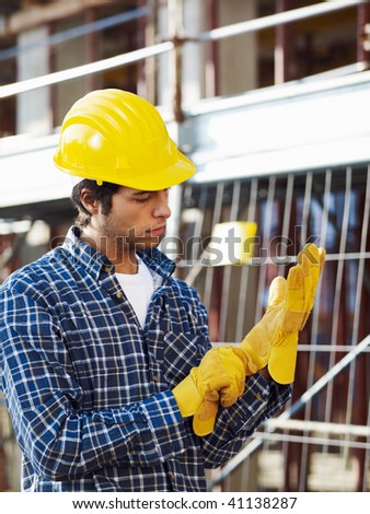 construction worker wearing protective gloves. Side view
