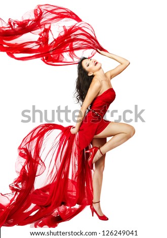 Woman  in red dress dancing with fabric flying on a wind flow. White Isolated - stock photo