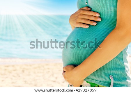 pregnant woman on the beach