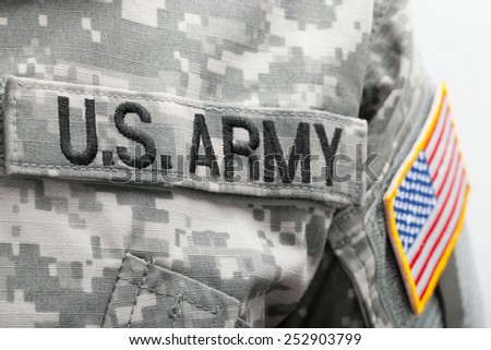 USA flag and US Army patch on solder's uniform