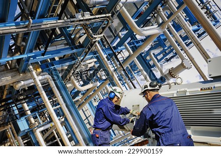 oil and gas workers with giant pipelines, powerful HDR effect.