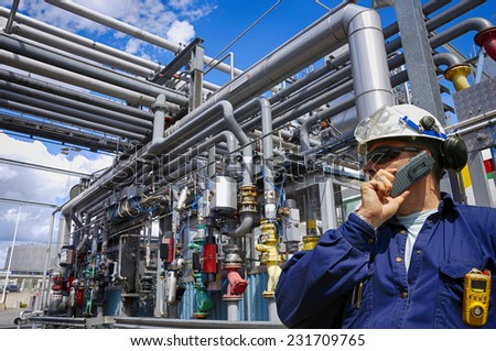 oil worker with giant pipelines construction