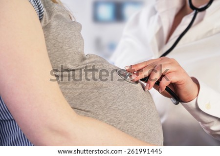 Doctor examining a pregnant woman