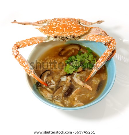 Braised fish maw in red gravy abalone mushroom with crab meat, The presentation of the more interesting and difference on with steamed crab was placed on top, White background have little nice shadow.