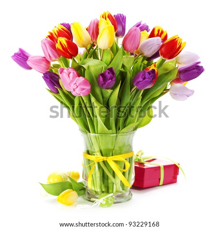 spring tulips with easter eggs on white background - stock photo