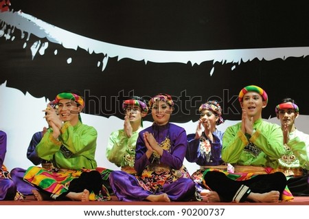 stock-photo-kuala-lumpur-malaysia-september-petronas-performing-arts-group-performs-dikir-barat-90200737.jpg