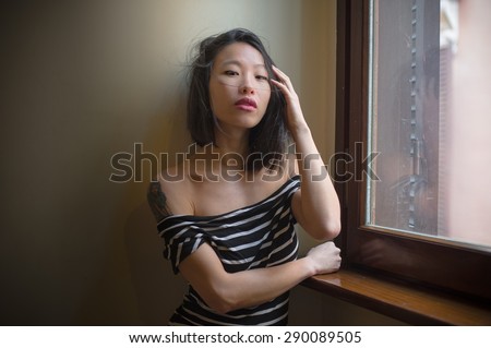 https://thumb7.shutterstock.com/display_pic_with_logo/620248/290089505/stock-photo-beautiful-sensual-asian-woman-posing-looking-seductive-at-camera-touching-hair-with-window-daylight-290089505.jpg