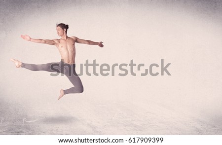 Modern ballet dancer performing art jump with empty copy space background