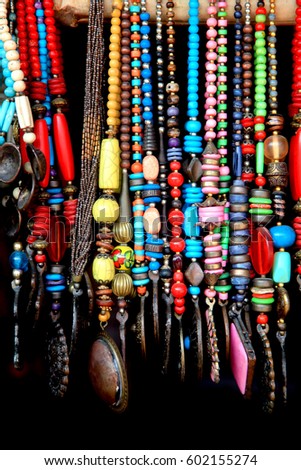 Indian Handicrafts Of Colorful Beads Against Black Background Indian Handicrafts Of Colorful Beads Against Black Background